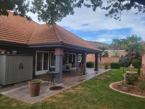 View of yard featuring a patio area and a mountain view
