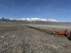 View of mountain background featuring rural landscape