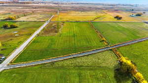 Aerial view of sparsely populated area featuring large plots for crops
