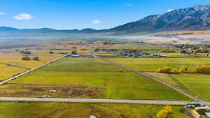 Aerial view of sparsely populated area with a mountainous background