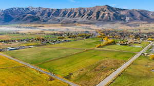 View of rural area featuring mountains and large plots for crops
