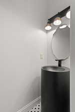 Bathroom featuring baseboards