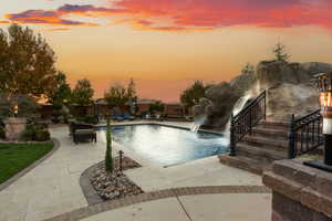 View of swimming pool featuring a patio and stairs