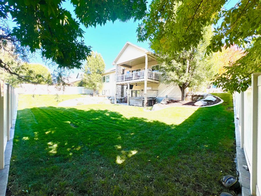 Fully fenced and landscaped backyard.