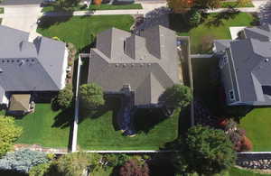 Aerial view showing fully fenced and landcaped yard.