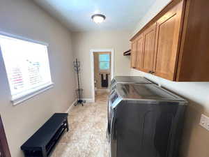 Laundy with storage off of kitchen. Gas and electric dryer hook up.