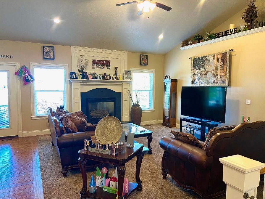 Updated carpet, gas fireplace, lofted ceiling, and ceiling fan.