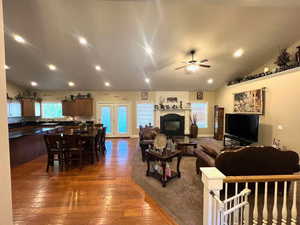 Open floor plan with living, dining and kithen, plenty of natural light, hardwood floors, new carpet.