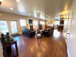 Combo family/recreation room with adjoining kitchen and walkout basement.
