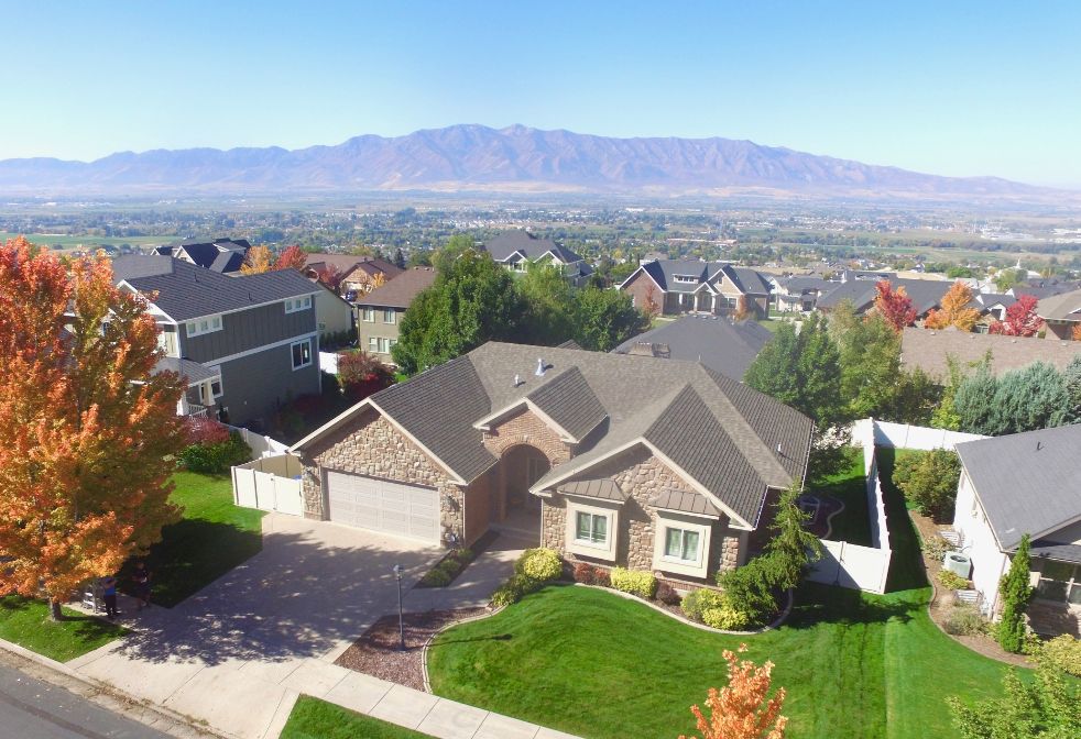Aerial perspective of neighborhood with the Wellsville mountains backdrop.