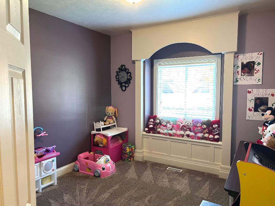 Morning light and bright. One of three bedrooms on the main floor. Closet organizer.