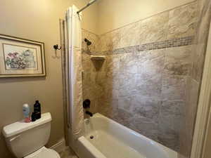 Full guest/hall bath with custom ceramic tile.