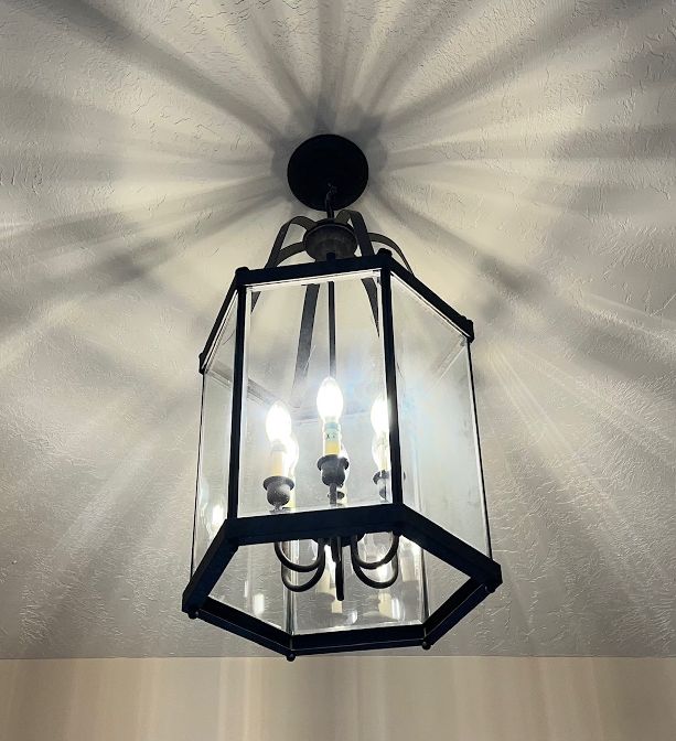 Contemporary lighting fixture greets your guests.