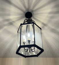 Contemporary lighting fixture greets your guests.