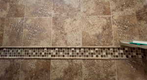 Ceramic tile bath/shower surround.
