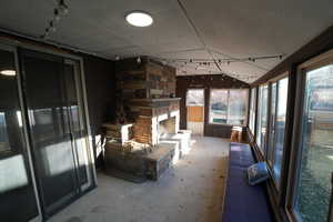 Sunroom / solarium featuring concrete floors