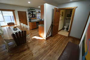 Dining area featuring light wood-style floors and recessed lighting