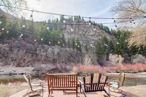 View of patio featuring a deck with water view