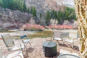 View of patio / terrace featuring a grill and a water view