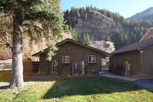 View of front of property with board and batten siding and a mountain view