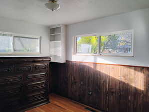 Spacious closet with dark wood-style flooring