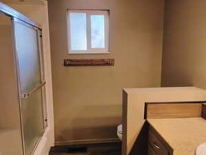 Full bathroom with vanity and shower / bath combination with glass door