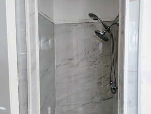 Bathroom view of a marble finish shower