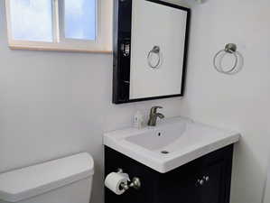 Bathroom featuring vanity and toilet