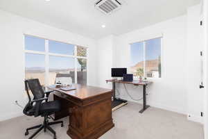 Home office featuring light carpet and recessed lighting