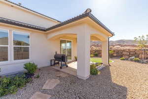 View of patio with area for grilling and a mountain view