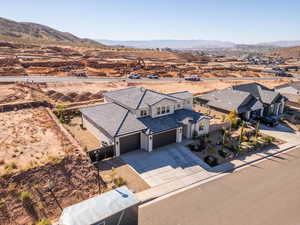 Aerial perspective of suburban area with a mountainous background