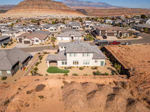 Aerial perspective of suburban area featuring a mountainous background