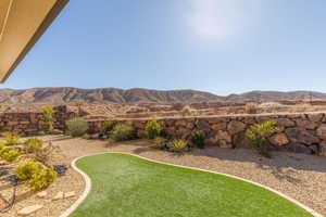 View of grassy yard featuring a mountain view