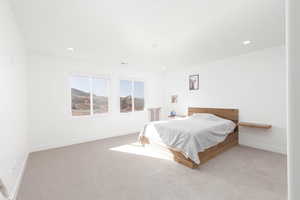 Bedroom featuring carpet and recessed lighting