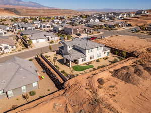 Aerial perspective of suburban area with a mountainous background