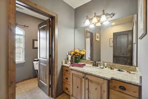 Bathroom with vanity and light tile patterned floors