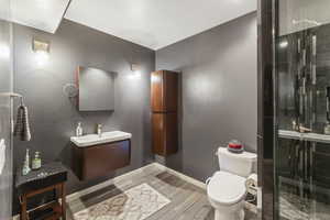 Bathroom with vanity and a stall shower