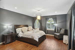 Bedroom featuring hardwood / wood-style floors and recessed lighting