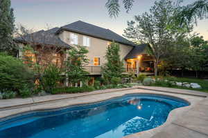 Swimming pool with a balcony and a patio area