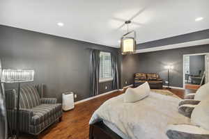 Bedroom featuring dark wood-type flooring and recessed lighting