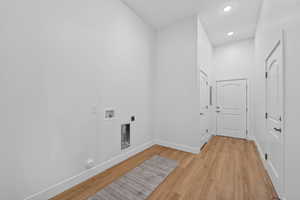 Laundry room with access to the garage and the community breezeway.