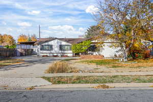 View of front of property with concrete driveway