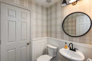 Stylish half bath on the main level is perfect