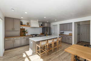 Kitchen with modern finishes and a breakfast bar perfect before school and homework after.