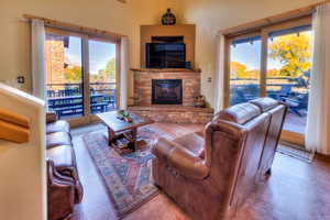 Living room with a stone fireplace