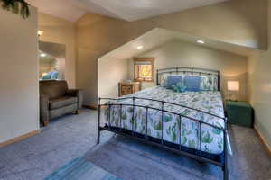 Bedroom featuring lofted ceiling, carpet floors, and recessed lighting