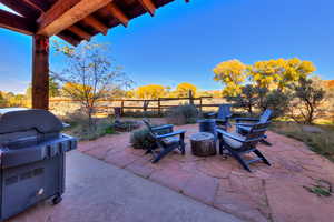 View of patio featuring grilling area and an outdoor fire pit