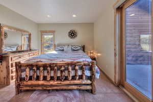 Bedroom with recessed lighting and access to outside