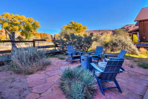 View of patio / terrace featuring an outdoor fire pit and a mountain view