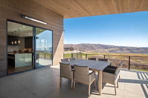 View of patio / terrace with outdoor dining area and a mountain view